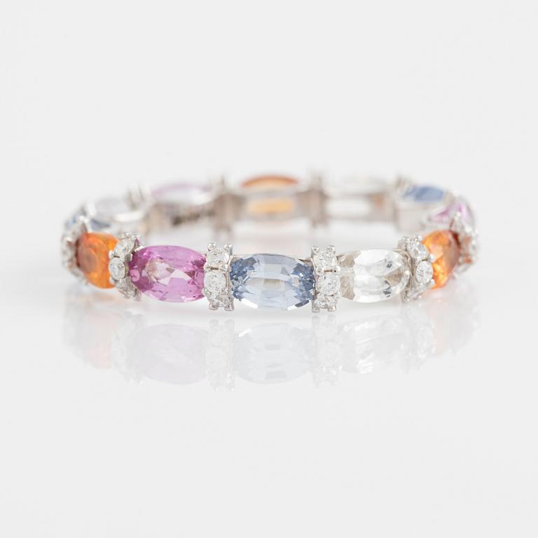 Multi coloured sapphire and brilliant cut diamond ring.