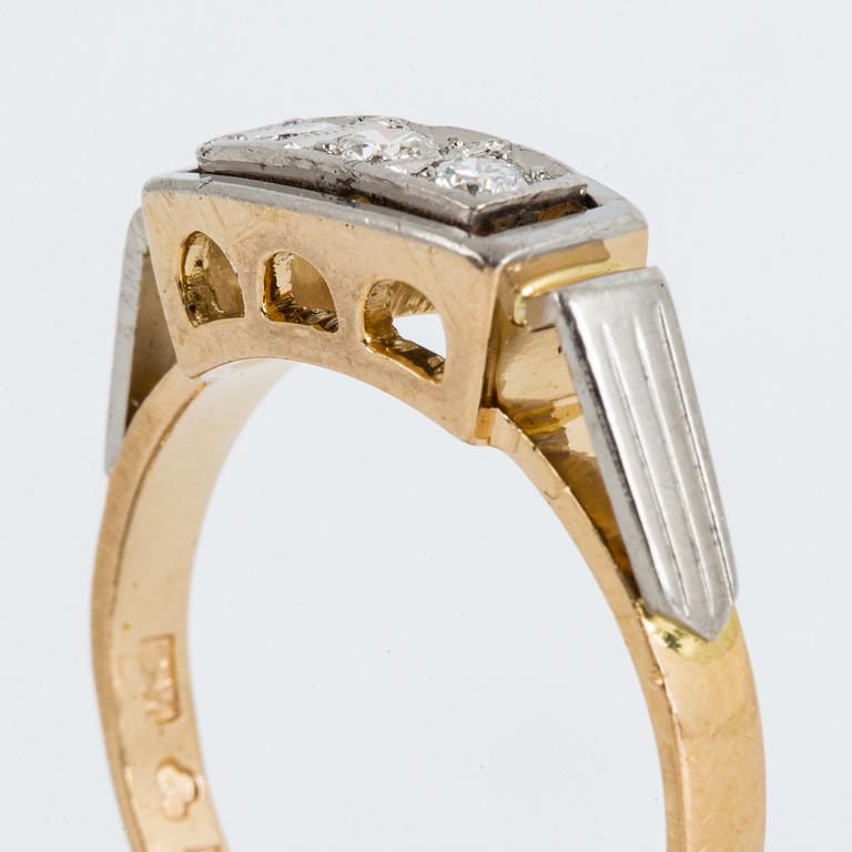 18K gold and brilliant-cut diamond three-stone ring.