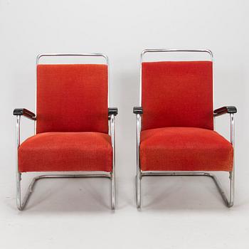 A pair of 1930s armchairs.