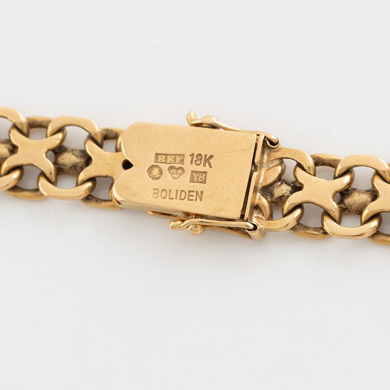 Armlänk, "x-länk", 18K guld. Bolidenguld.