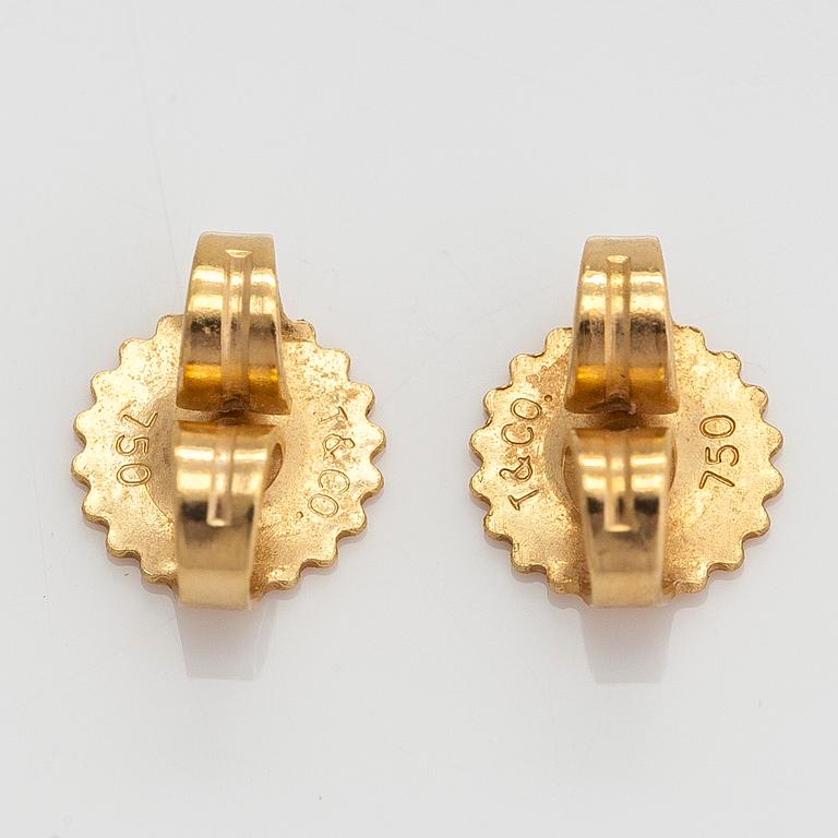 Tiffany & Co, a pair of 18K gold "'Cross Stitch' earrings.