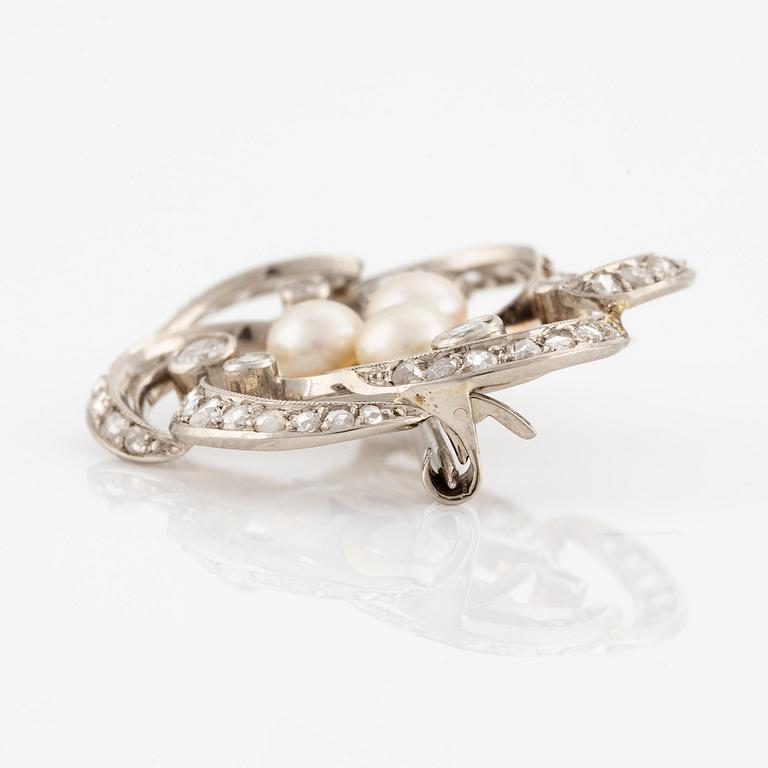 A W.A. Bolin brooch in 18K white gold set with round brilliant-, eight- and rose-cut diamonds and pearls.