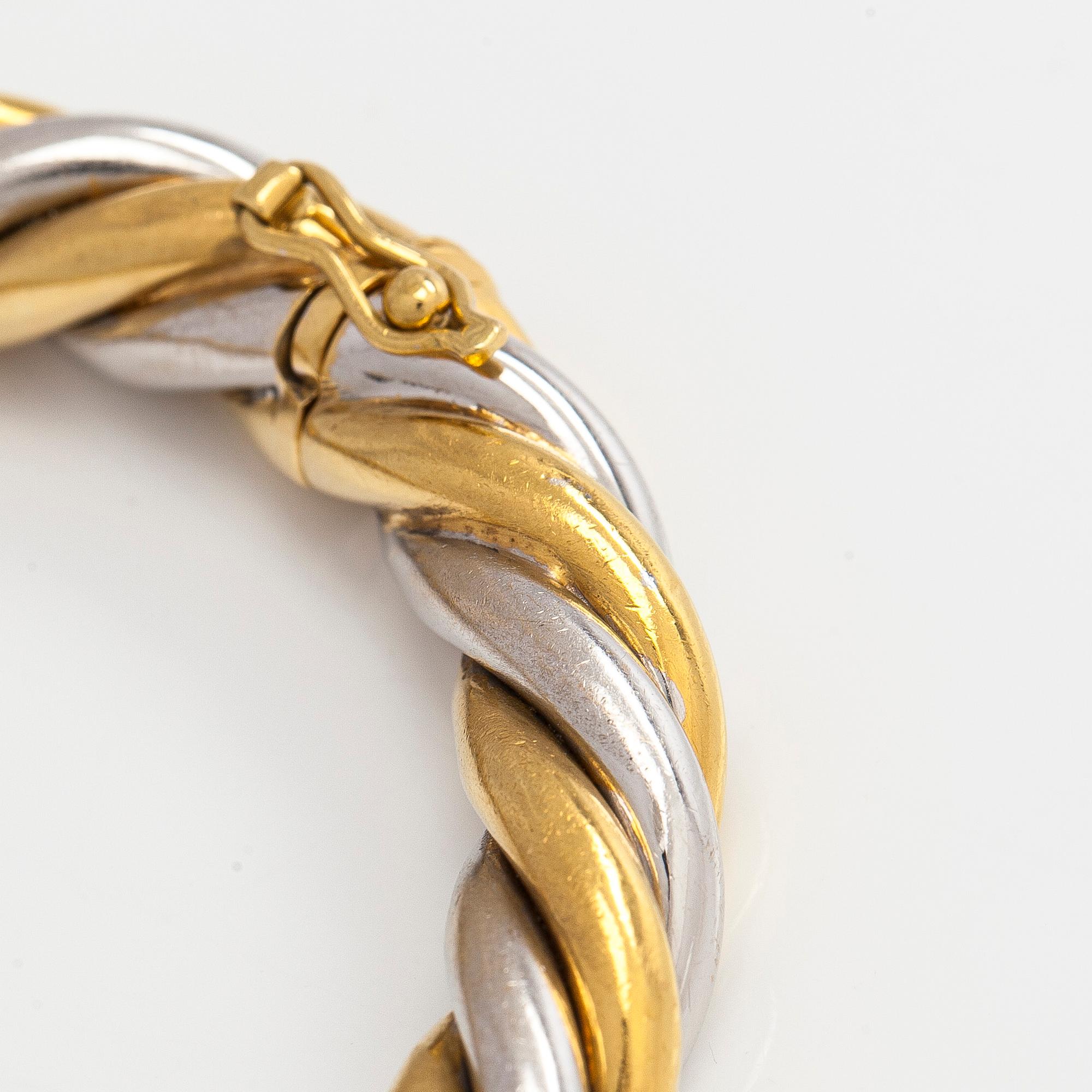 An 18K gold/white gold bracelet, Switzerland.