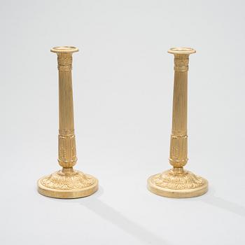 A PAIR OF CANDLESTICKS, gilt bronze, France fists half of the 19th century.