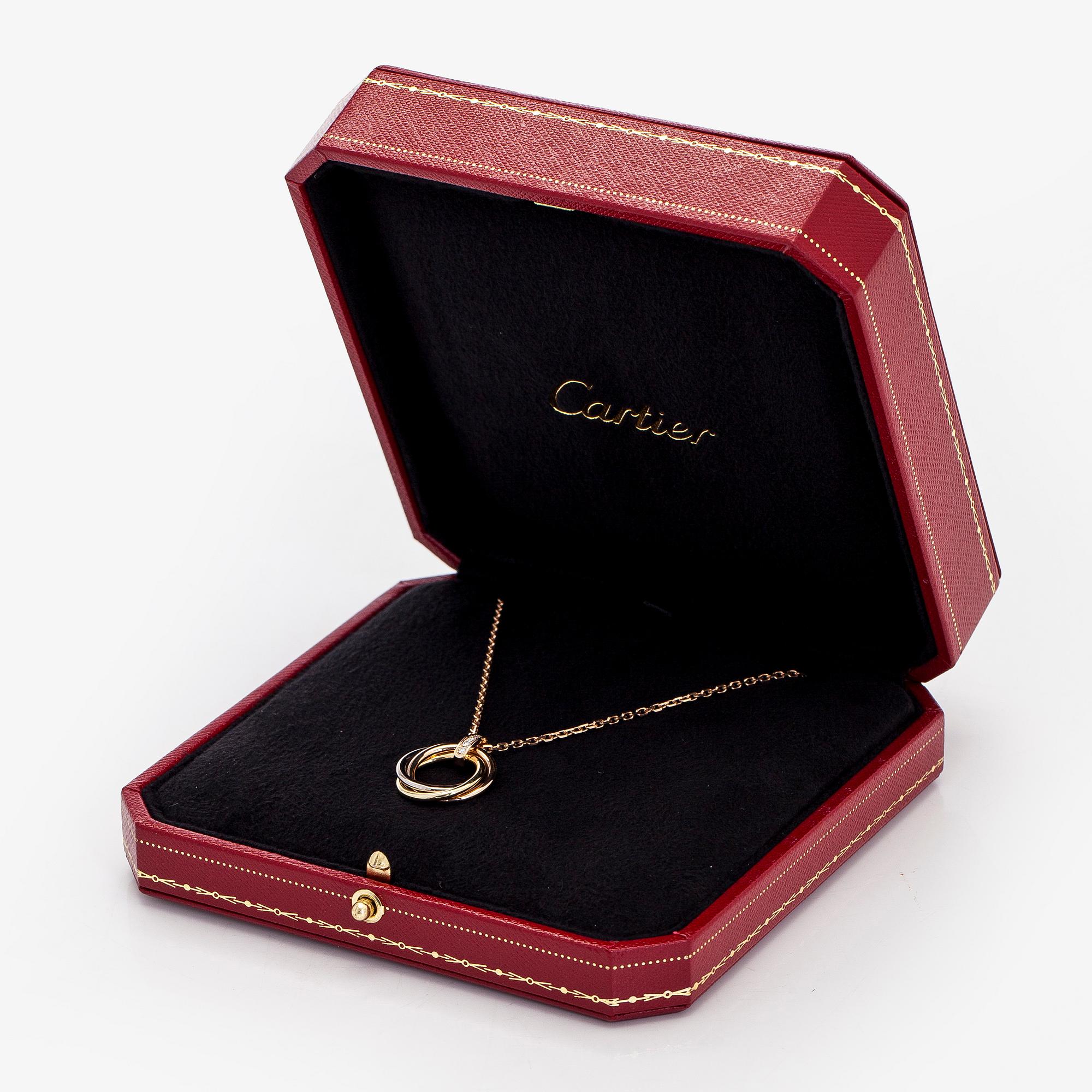 Cartier, an 18K gold 'Trinity Pendant' necklace with brilliant-cut diamonds.