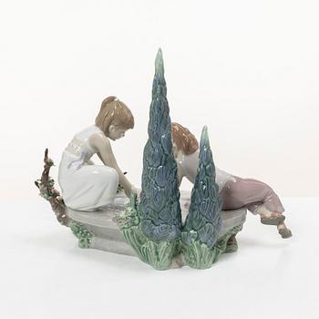 Lladró, three figurines,"Girl with French bulldog", "Girl with Dalmatians" and "Petals in the pond", Spain.