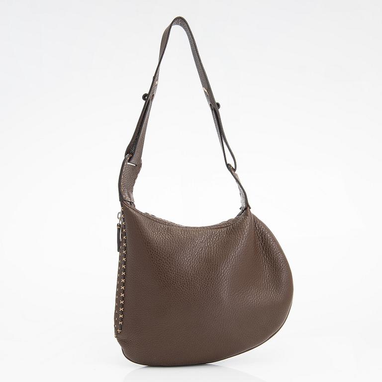 Fendi, a brown leather bag.
