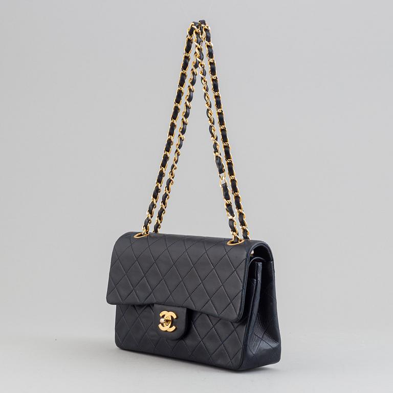 Chanel, a navy leather 'Double Flap Bag', 1989-91.