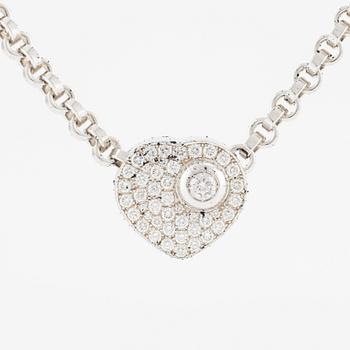 An 18K white gold Chopard "Happy Diamonds" necklace set with round brilliant-cut diamonds.