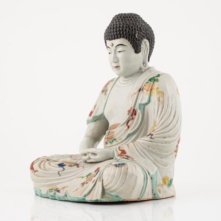 A porcelain buddha, Japan, 20th century.