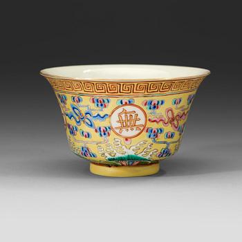 A famille rose yellow ground bowl, Qing dynasty, Guangxu six-character mark in red and of the period  (1875-1908).