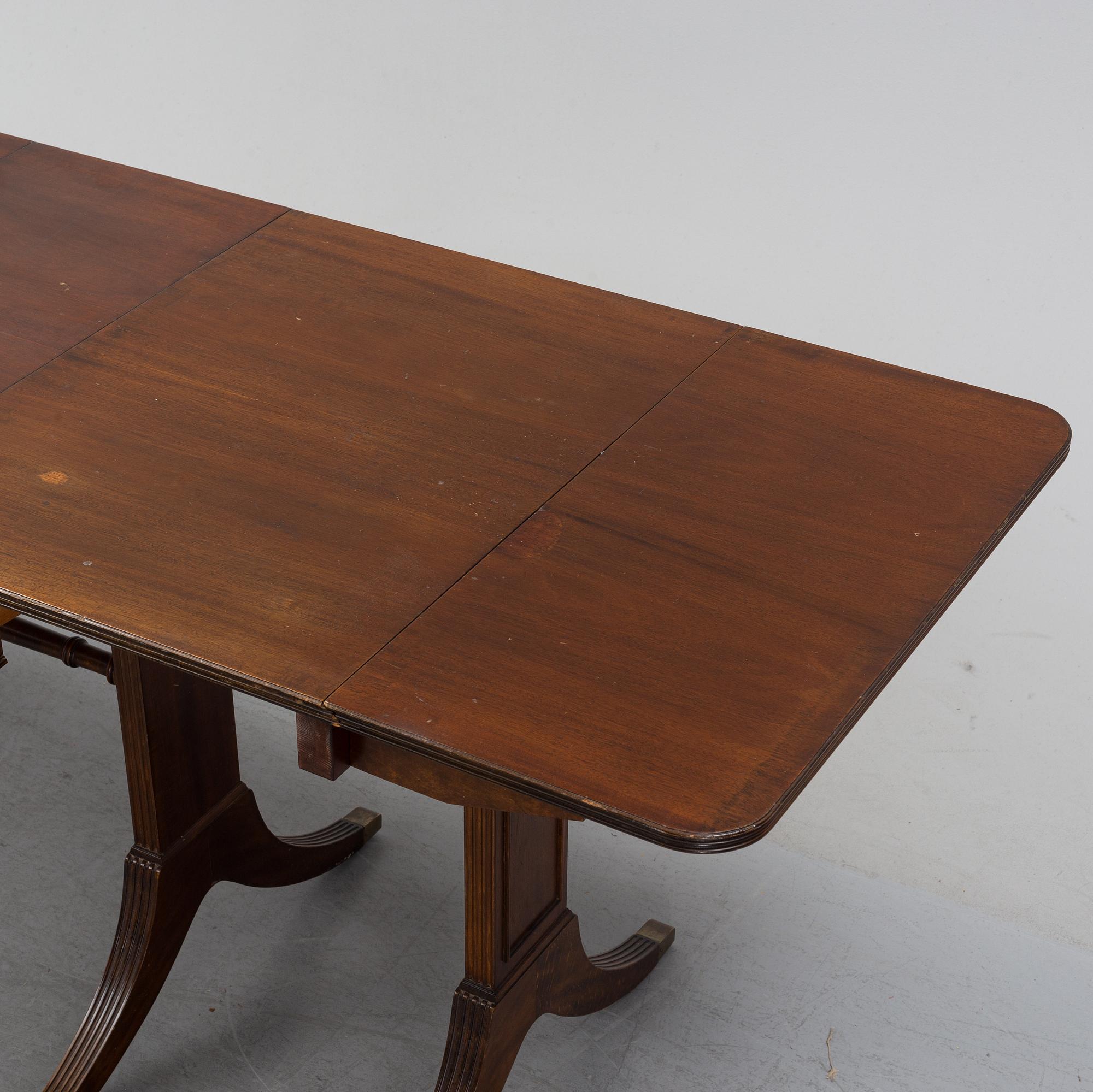 A mahogany dining table with folding and additional leaves, Nordiska Kompaniet, designed 1945.