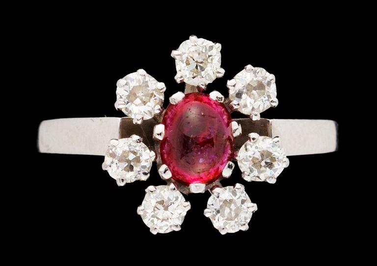 A gold diamond and ruby ring.