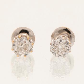 A pair of 14K white gold earrings set with round old-cut diamonds.