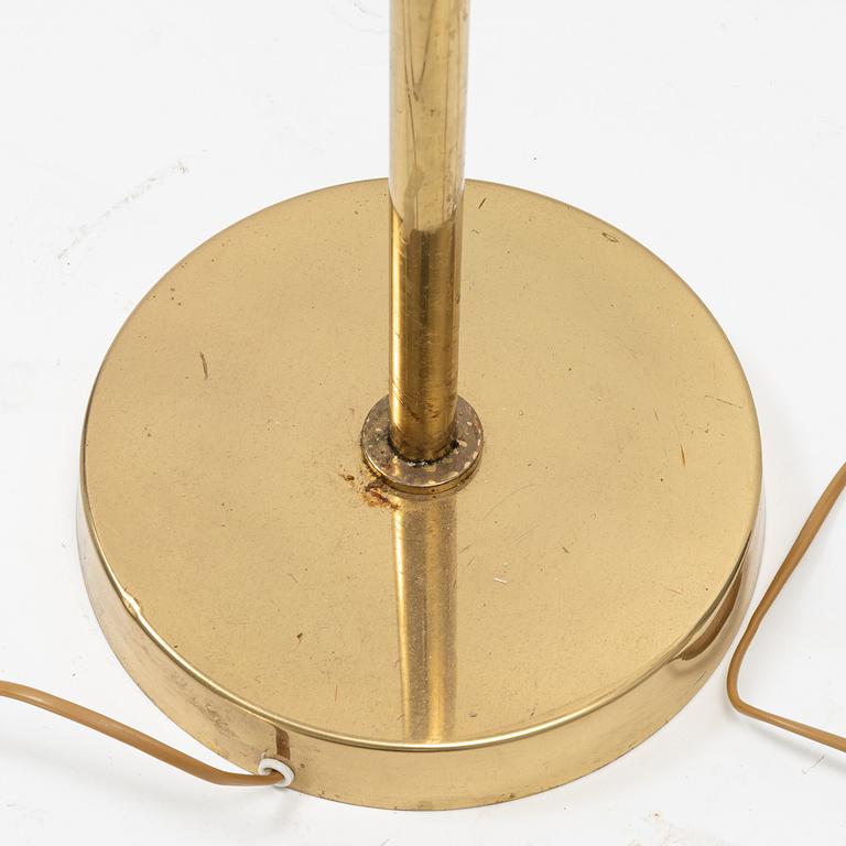 A pair of model 'G-18' brass floor lights, Bergboms, second half of the 20th Century.