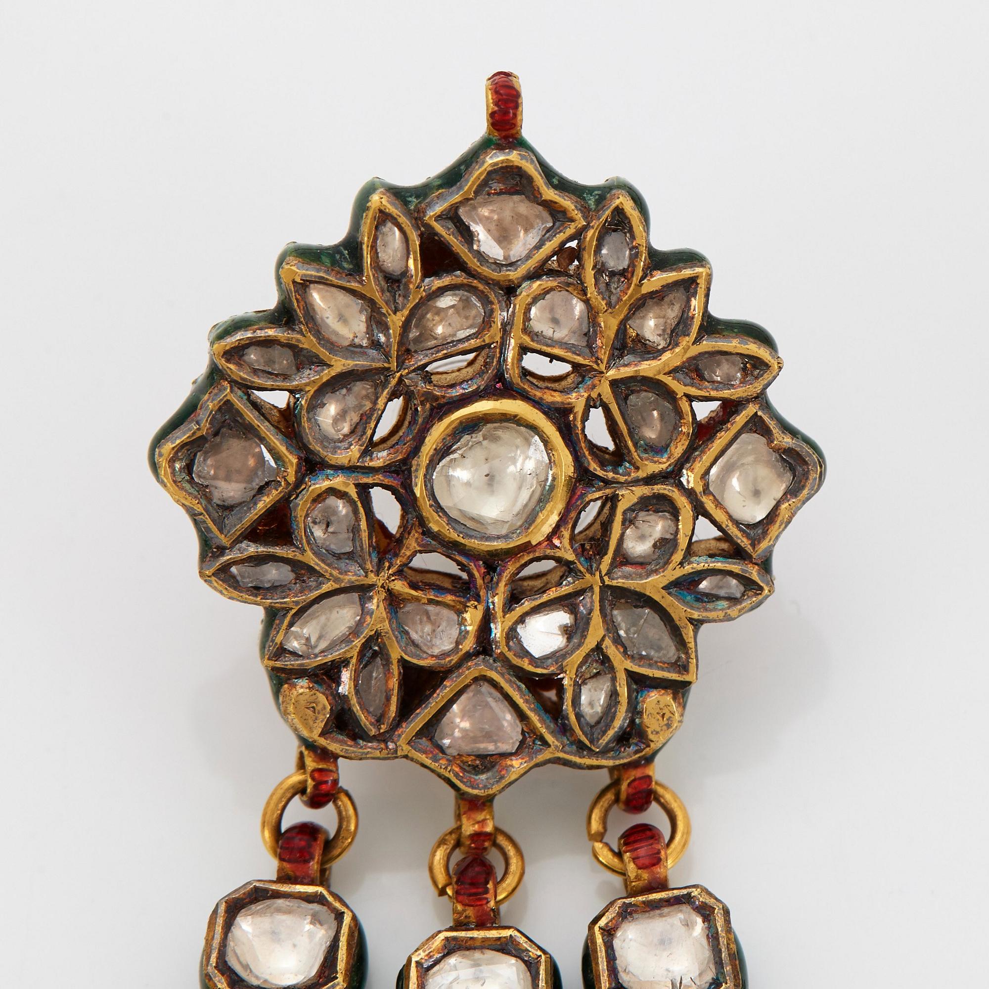 An Indian demi parure comprising a necklace and a pair of earrings.