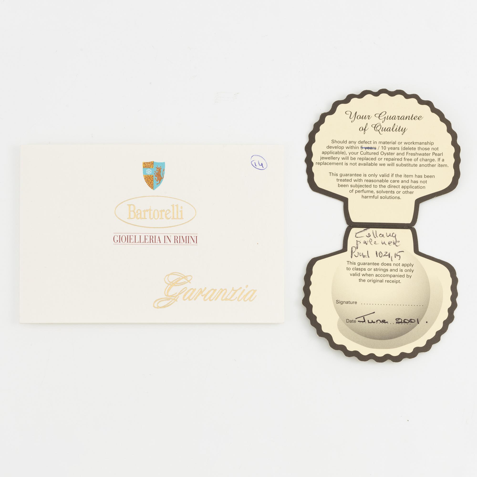 Necklace of cultured freshwater pearls, clasped with 14K white gold and round brilliant-cut diamonds.