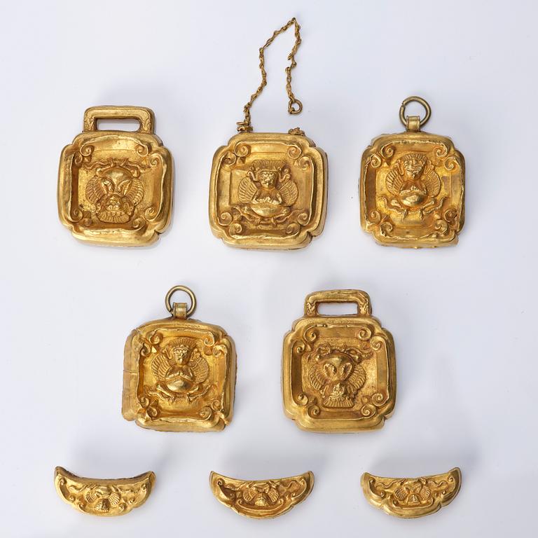 A set of eight gold 'Garuda' belt plaques, Yuan/early Ming dynasty.