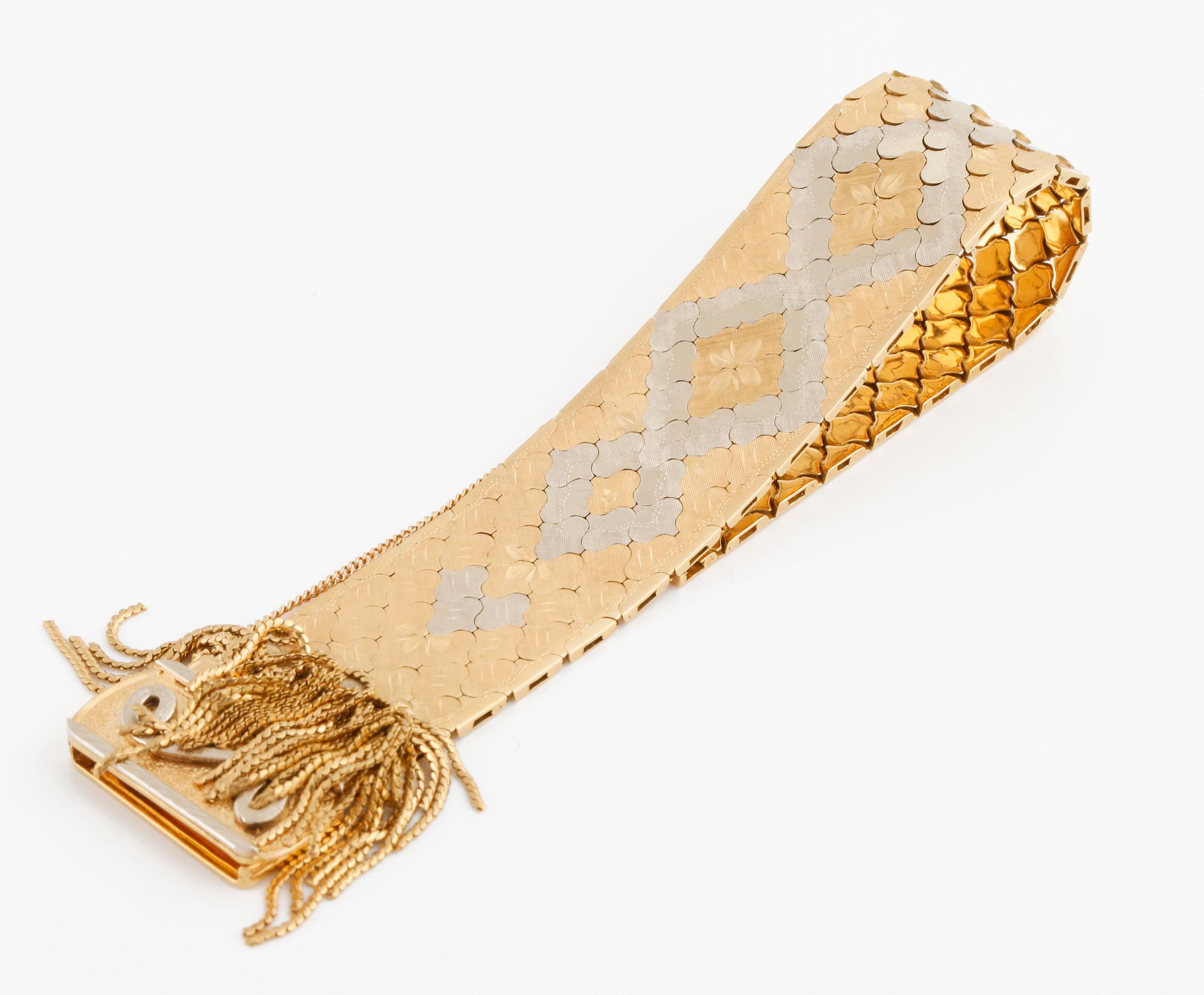 An tricolor gold bracelet with Italian hallmarks.