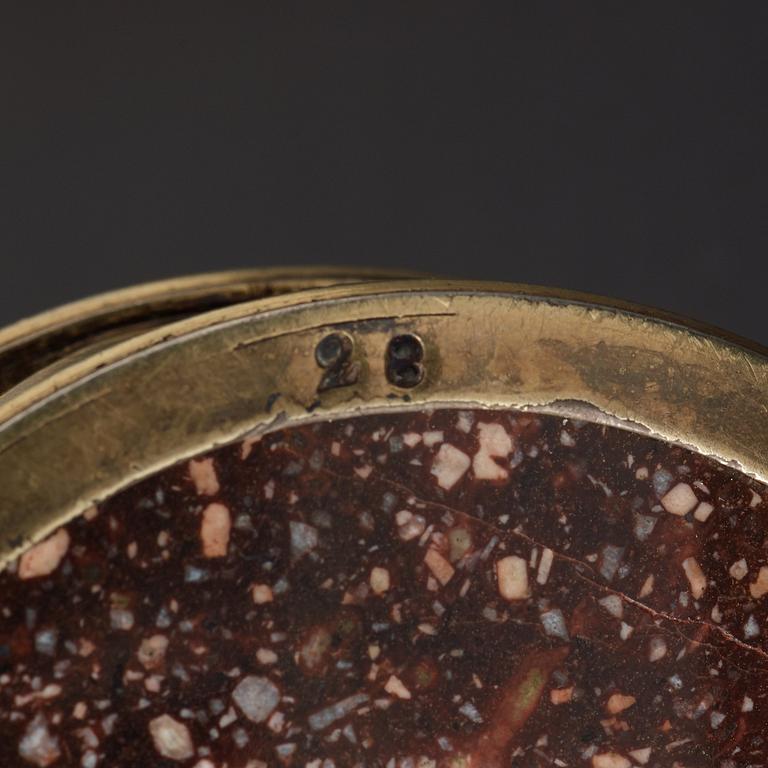 A pair of gilt silver and porphyry salts, by Gustaf Folcker, Stockholm 1827.