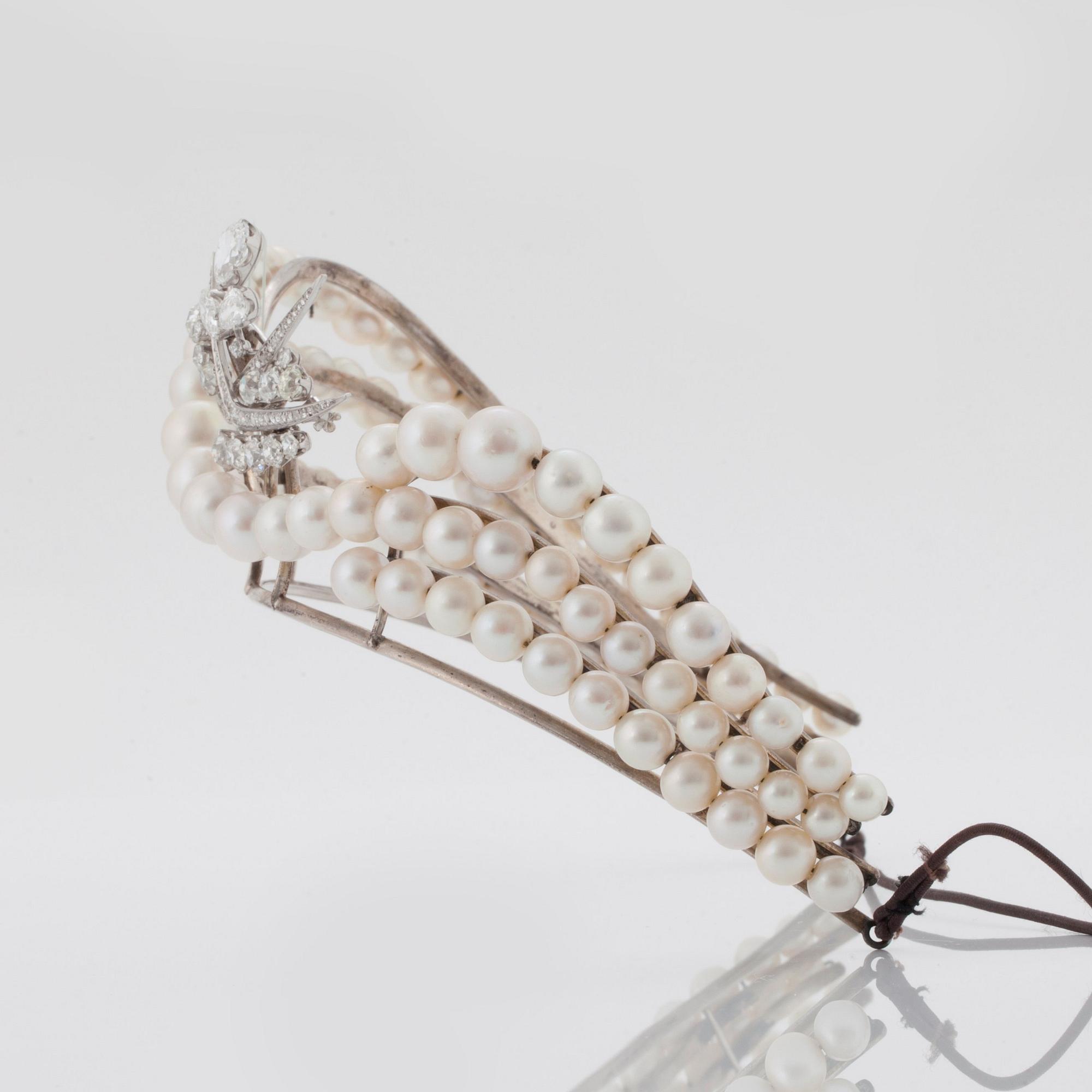 A TIARA with cultured pearls and a detachable brooch set with old-cut diamonds.