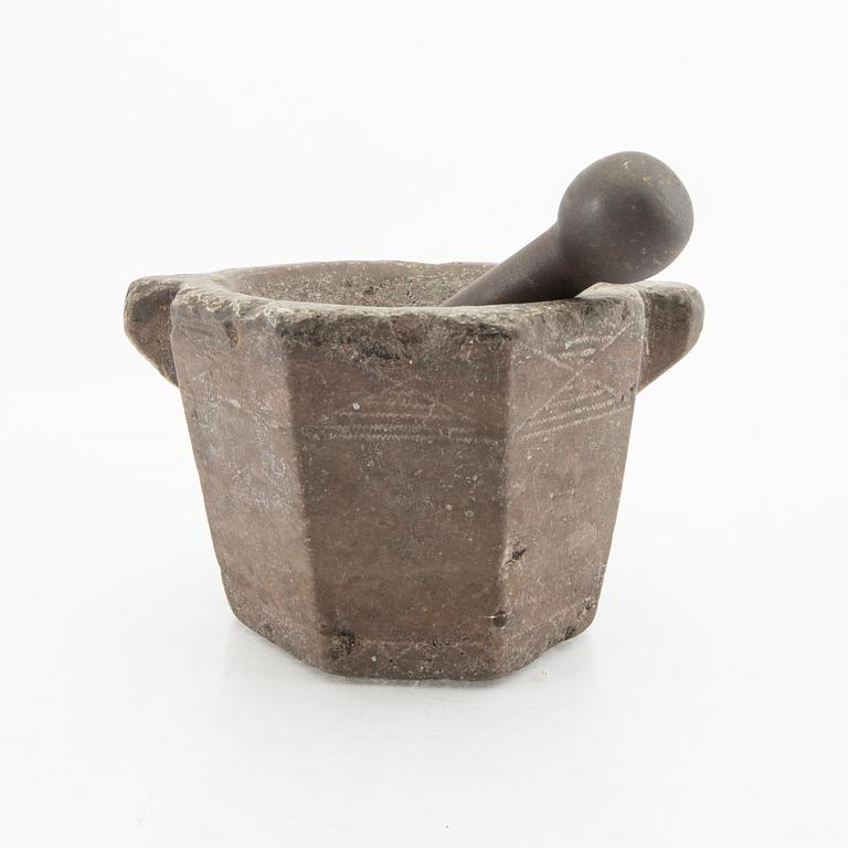 A Swddish 18th/19th century limestone and cast iron mortar.