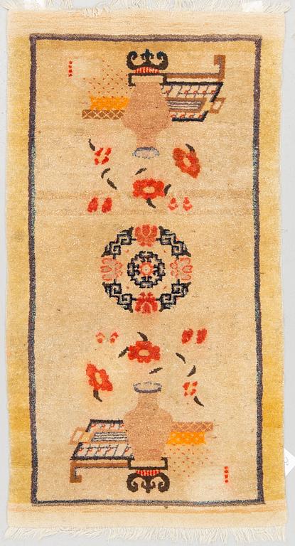 A RUG, Old China/Tibet, ca 130 x 70 cm.