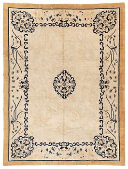 An antique Chinese carpet, 404 x 304 cm.