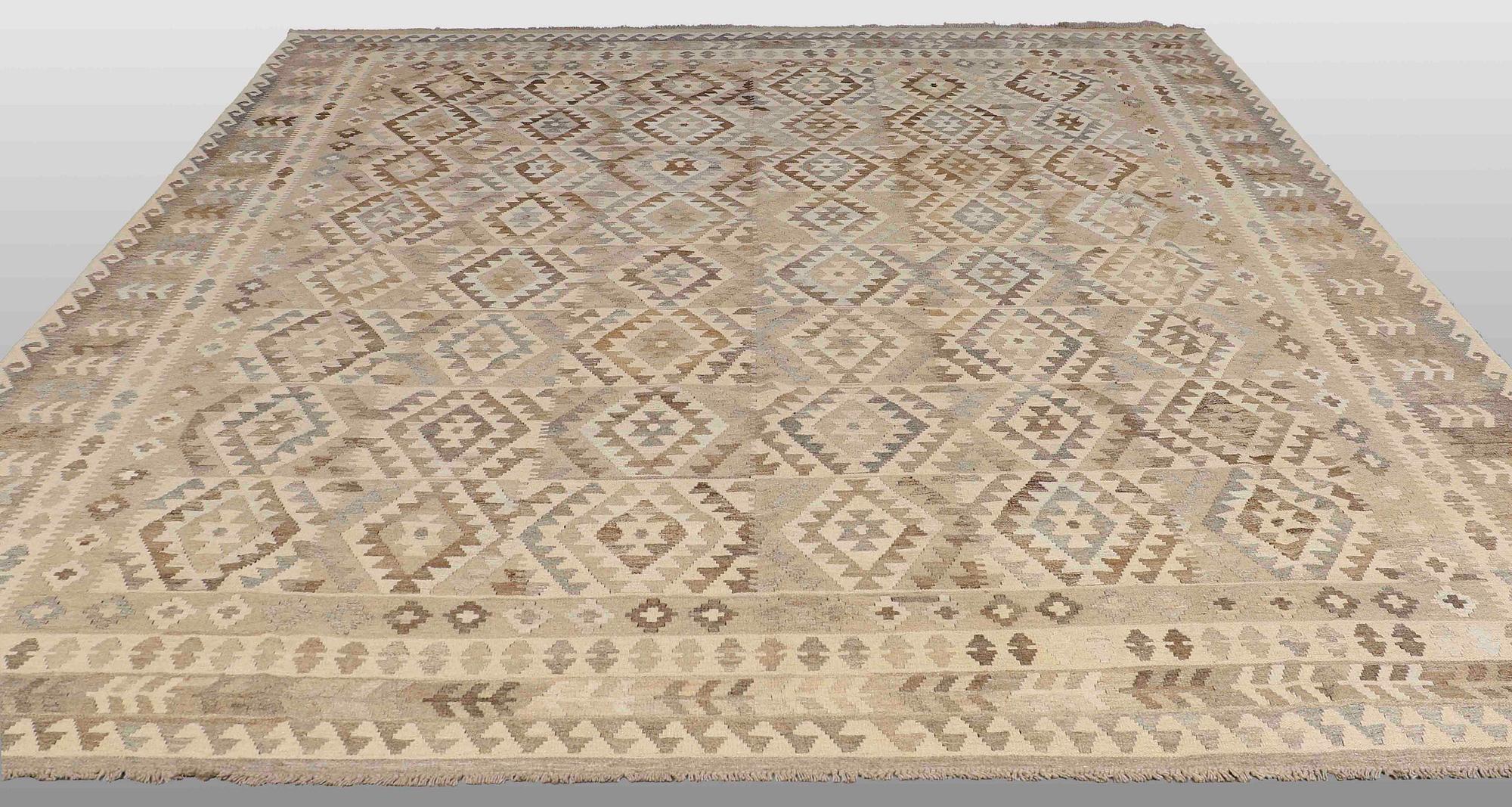 A CARPET, kilim, around 389 x 332 cm.