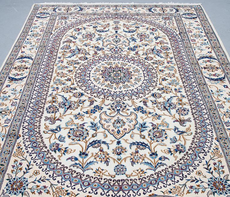 A carpet, Nain, part silk, ca 296 x 192 cm.