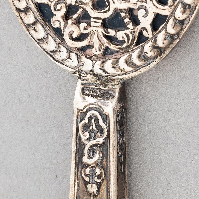 Goblet on foot, hand mirror, and box, silver.