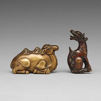 592. Two bronze pen rests, Qing dynasty, 18th Century.