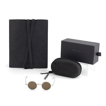 A pair of Uma Wang + Rigards, 'The Victorian', sunglasses and a Uma Wang, ipad case.