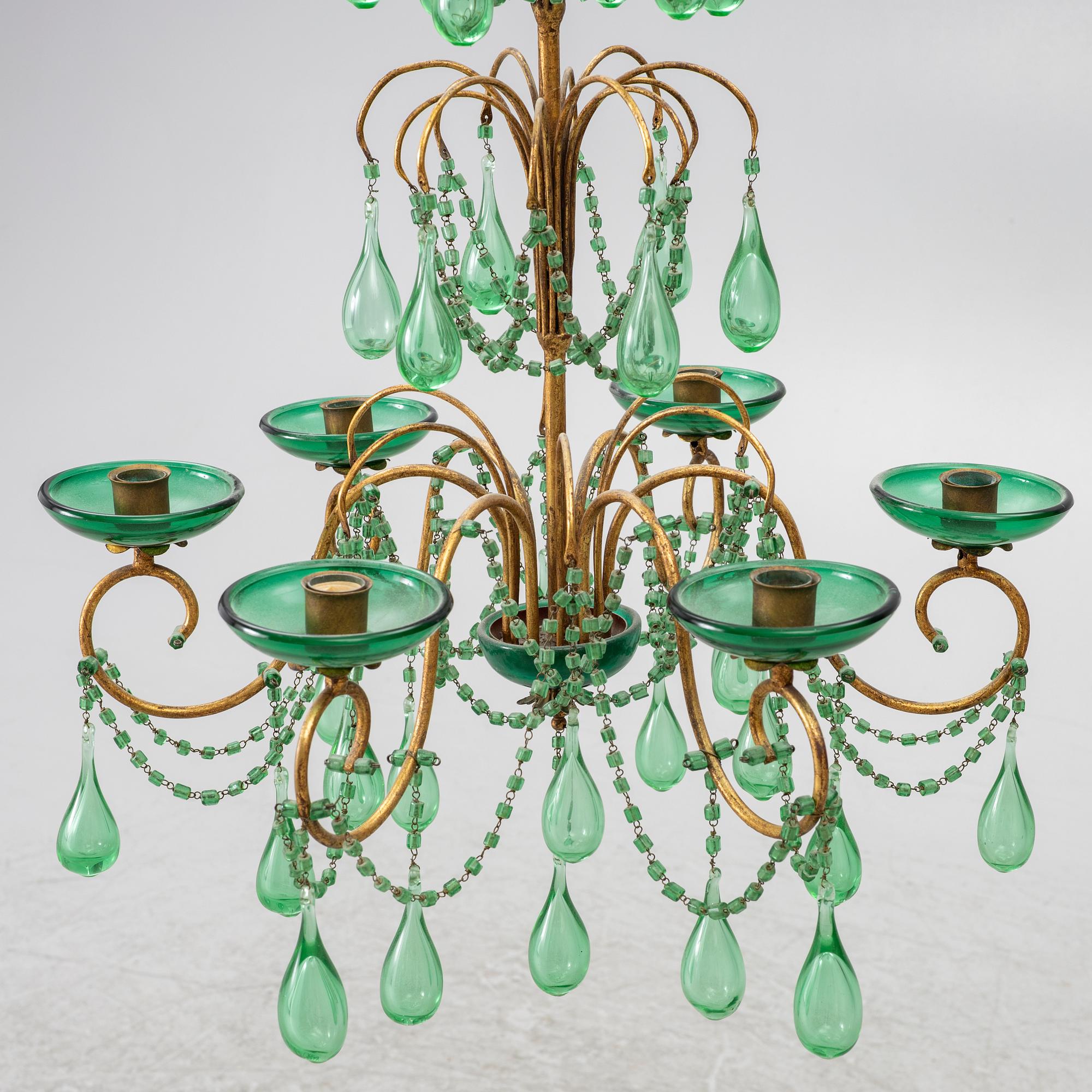 A chandelier, likely from Italy, circa 1950.