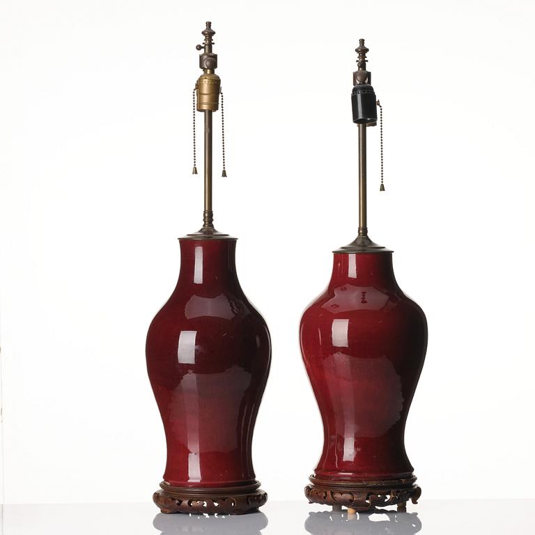 A set of two flambé glazed table lamps/vases, Qing dynasty, 19th century.