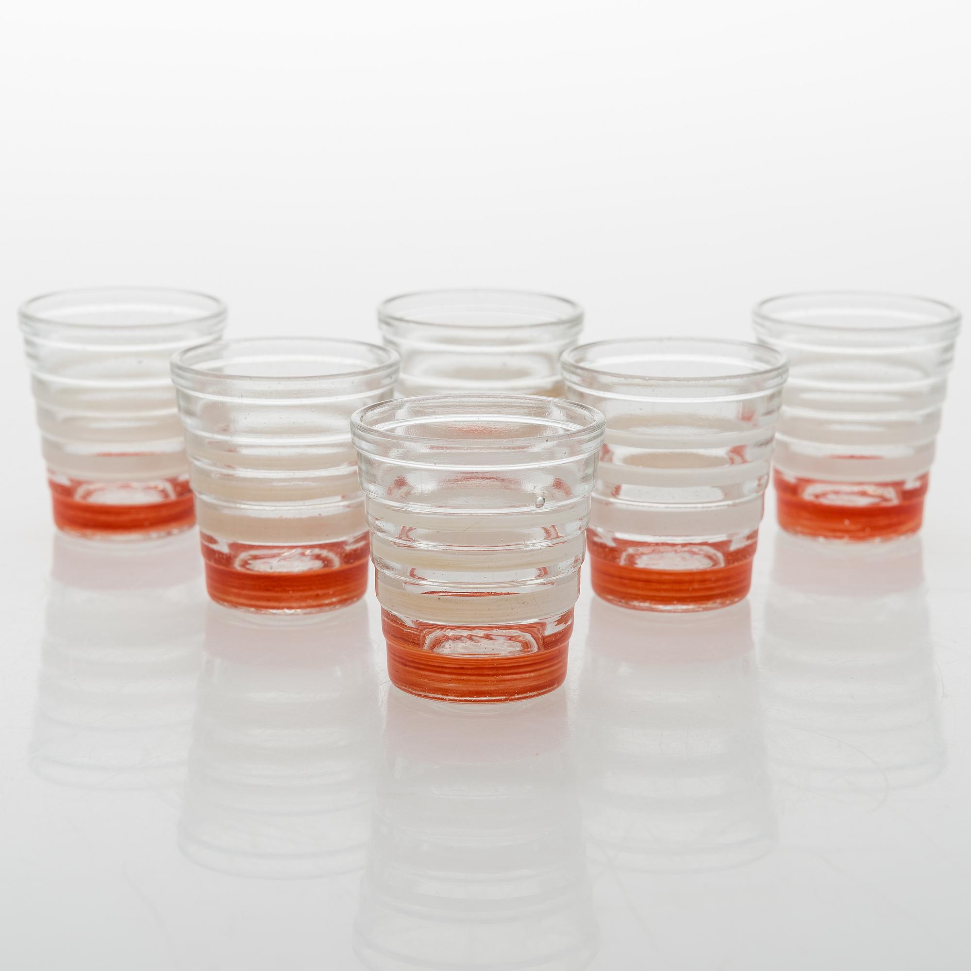A set of 6 snapsglasses and a bottle designed by Aino Aalto for Karhula in the 1930-1940's.