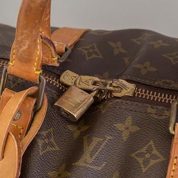 A Keepall Bandouliere 55 WEEKEND BAG by Louis Vuitton.