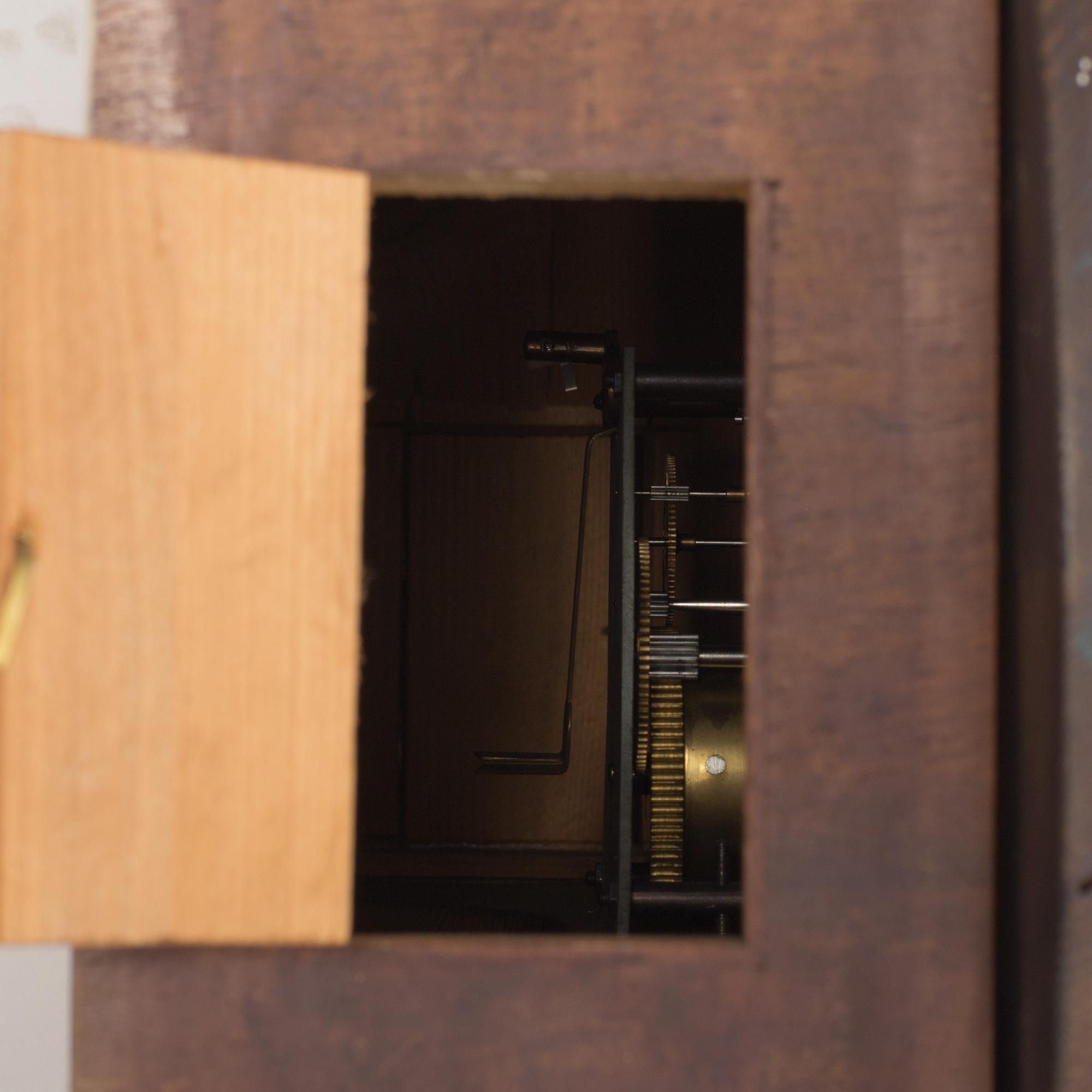 A 19th century wall clock marked LFS Schutz Marke, Germany.