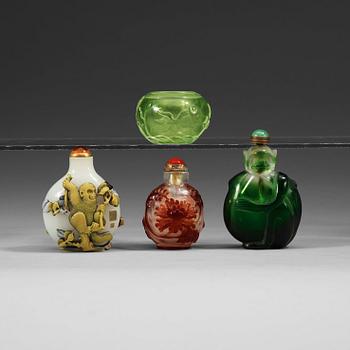 1378. A set of three Peking glass snuff bottles with stoppers and a brush washer.