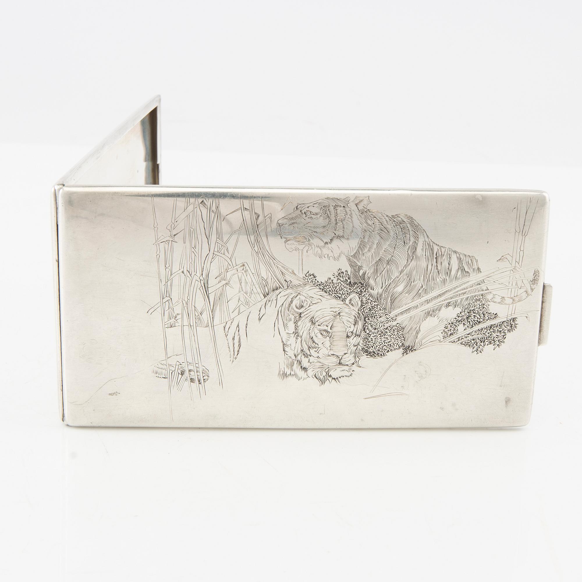 American silver cigarette case with engraving from World War II.