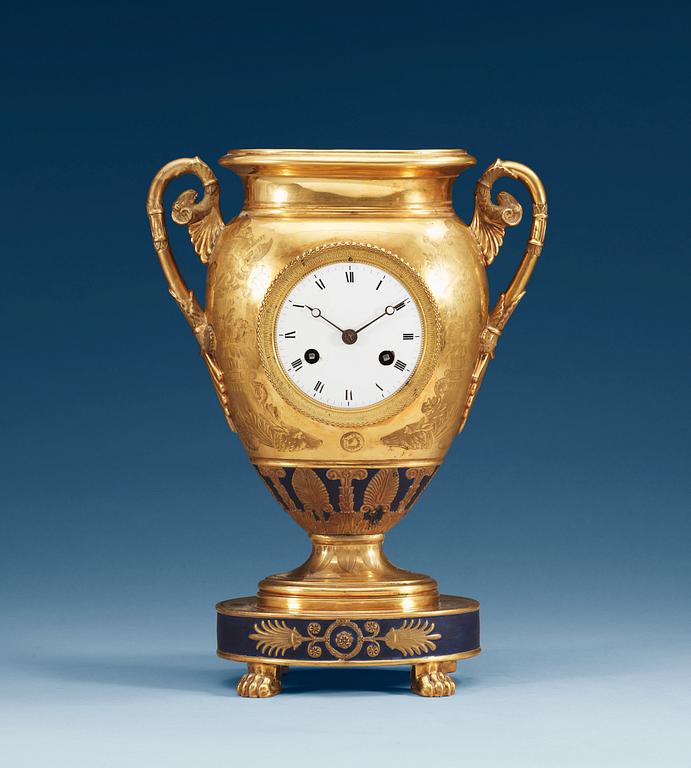 An Empire gilt porcelain table clock, presumably Russian.