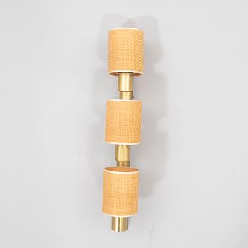 Hans-Agne Jakobsson, a brass wall lamp.