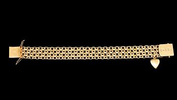 ARMBAND, 18k guld, länk med en berlock, Stockholm, 1958. Vikt 40 g.