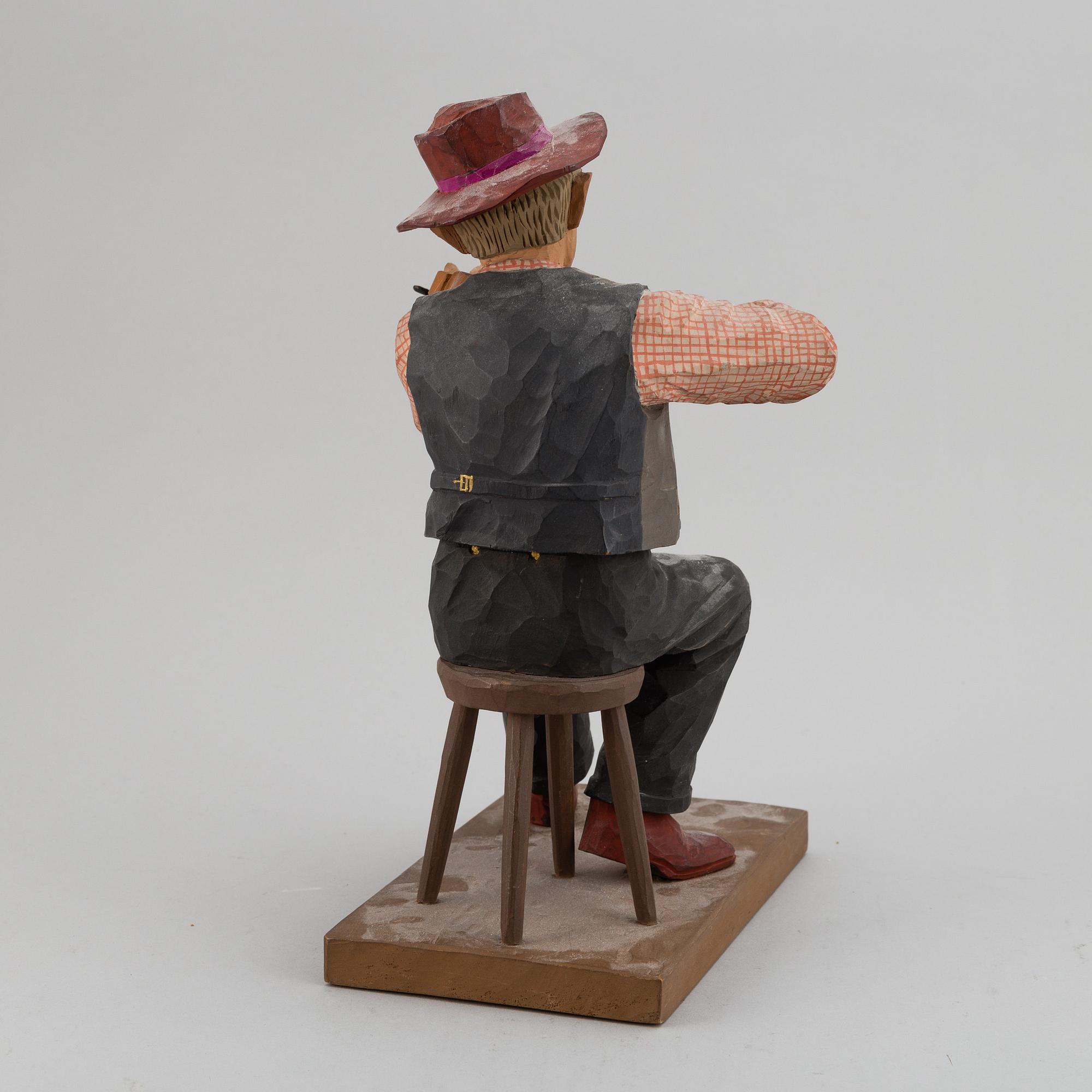 HERMAN ROSELL, a painted wooden sculpture.