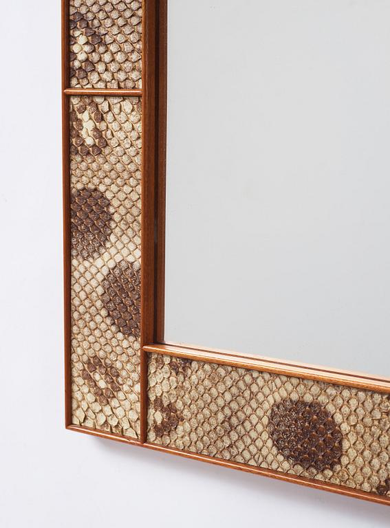 Josef Frank, a snakeskin framed mirror, Firma Svenskt Tenn, Sweden, executed in 1940.