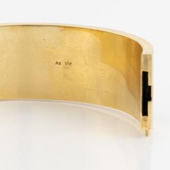 A Black Starr & Frost bracelet and a pair of earrings.