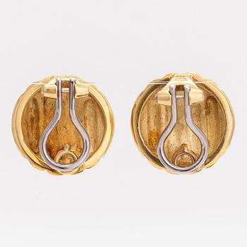 A pair of 18K gold earrings.