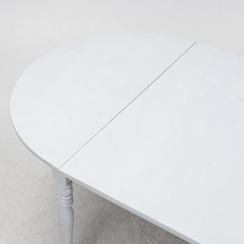 A late 19th century painted dining table.