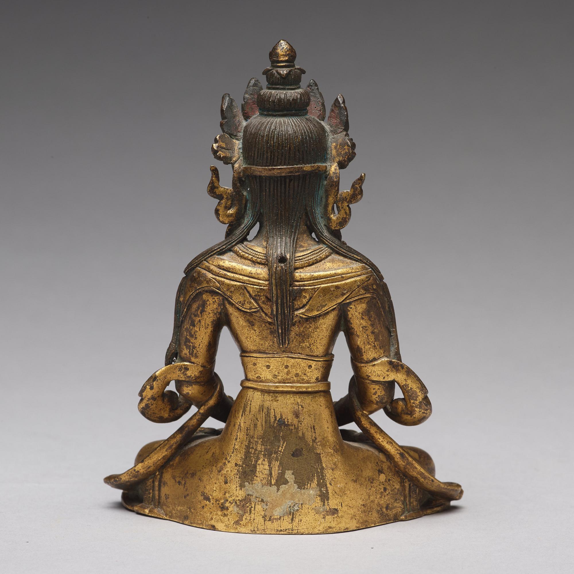 A gilt bronze figure of Amitayus buddha, Tibeto-Chinese, 18th Century.