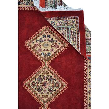 A Persian Rug, approximately 240 x 165 cm.